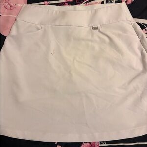 Greg Norman White skort. Apr. 14 1/2 inches.